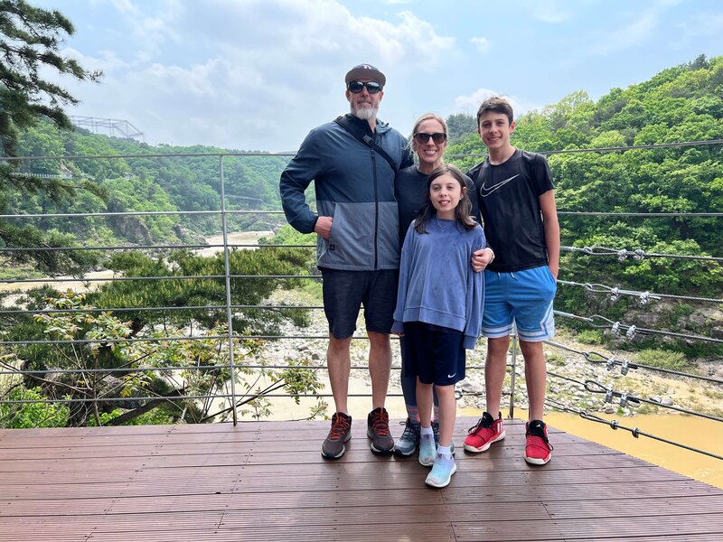 Family portrait on a scenic overlook in South Korea – exploring diversity through parenting abroad on Leaving Main Street