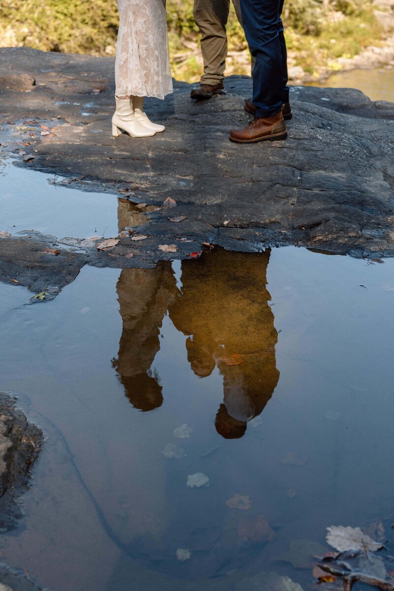 reflection of couple saying their vows at fall creek falls elopement