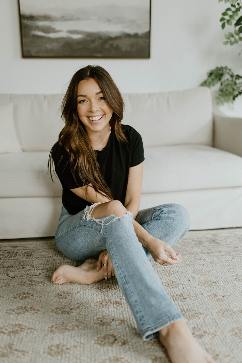 woman sitting in a chair smiling at camera