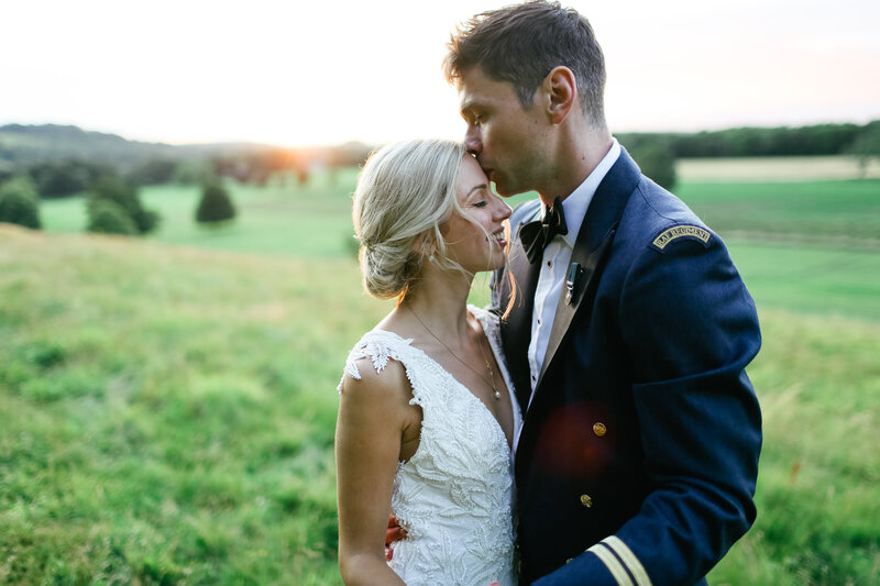 couple-kissing-in-countryside-at-luxury-wedding-in-hampshire
