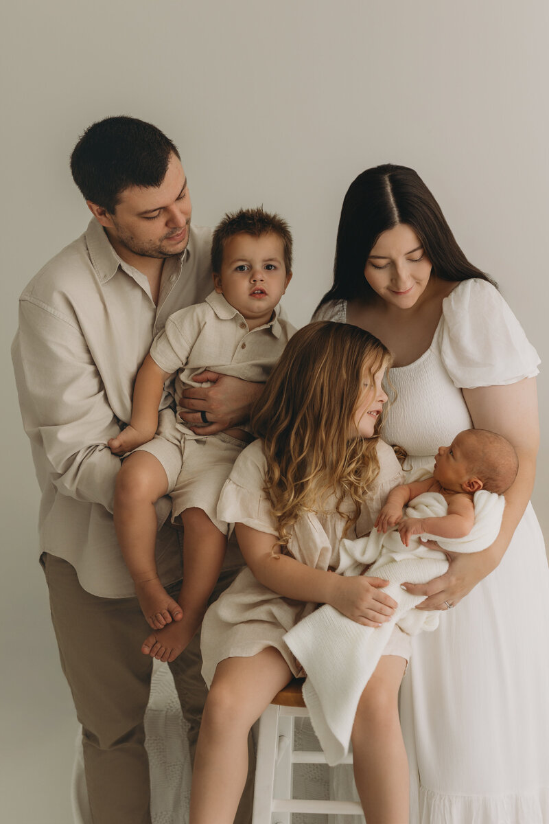 Family of 5 for a newborn shoot. Family with 2 boys and 1 girl.newborn session