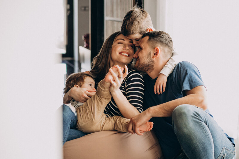 young-family-with-their-sons-home-having-fun