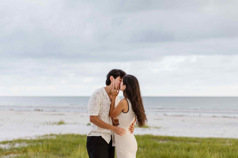 Couple kissing on the beach