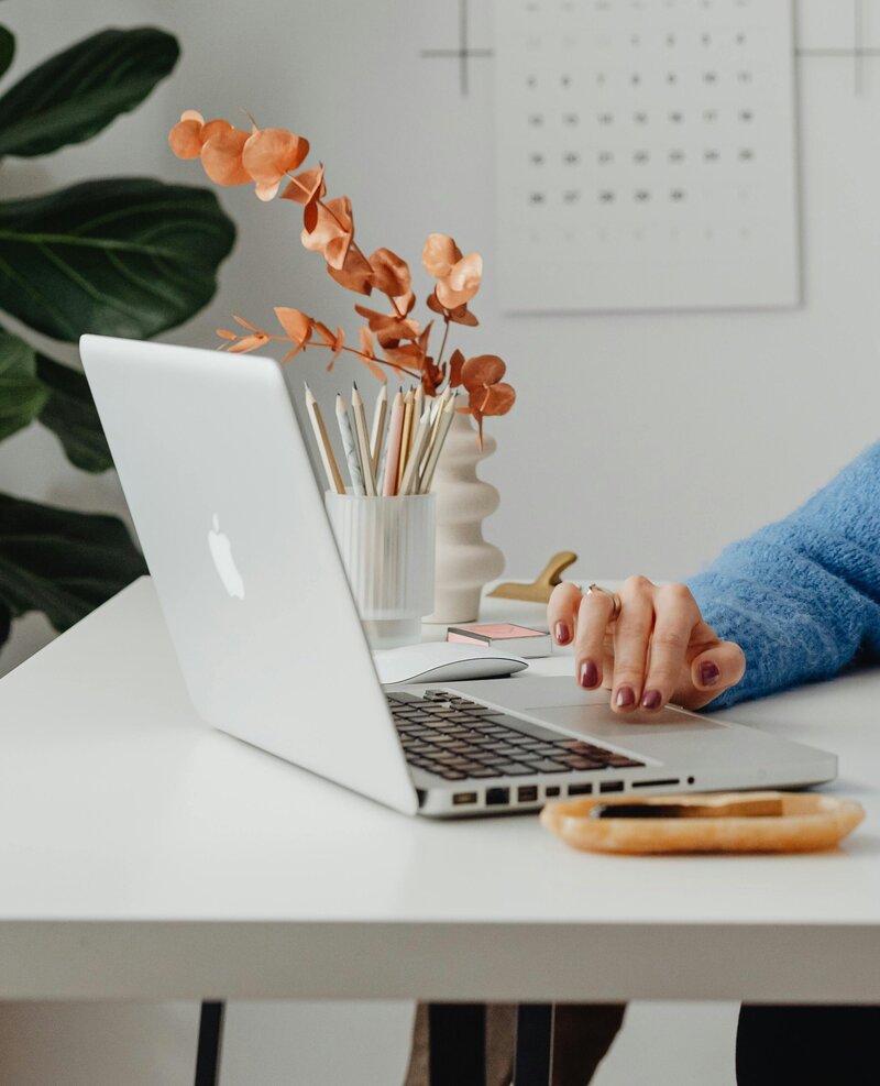 Woman working on her laptop at home office