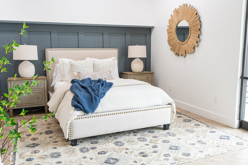 white bed with blue and gold accents