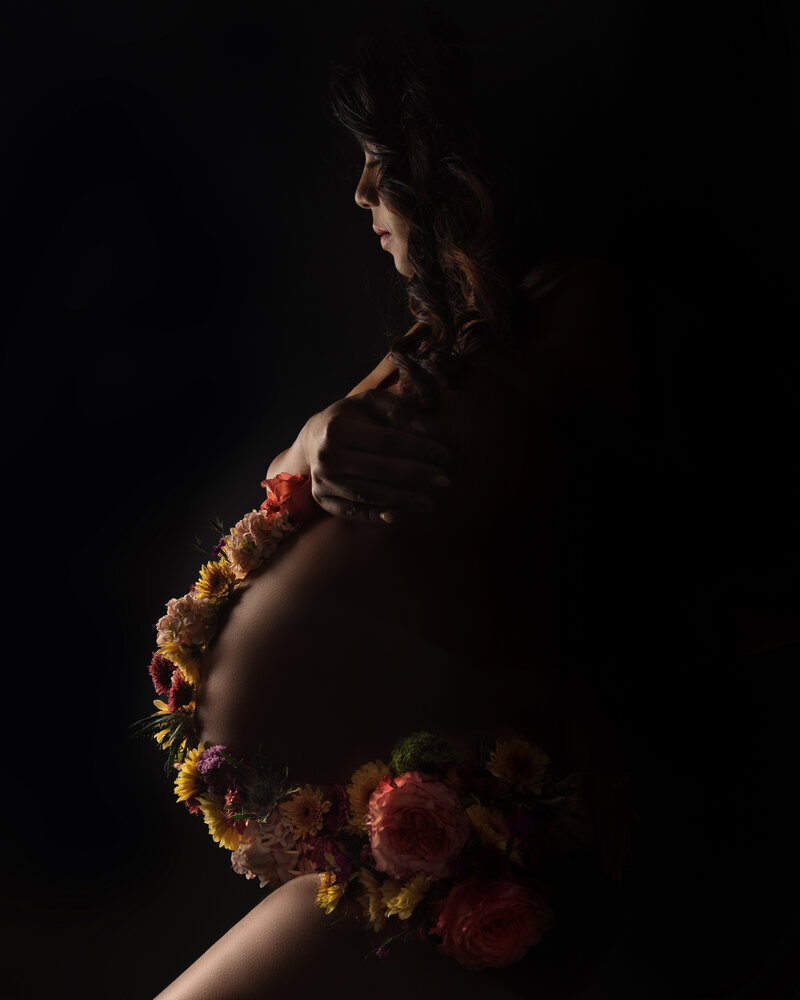 beautiful maternity photograph in luxury gown with vintage florals