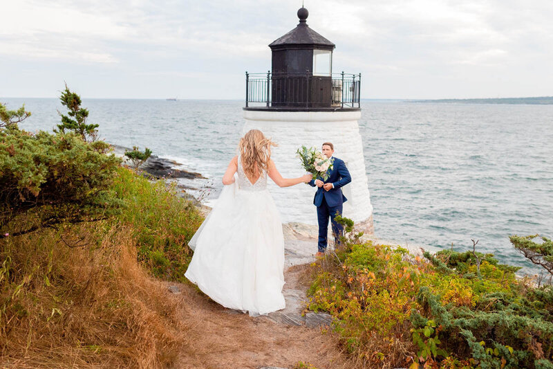Bride walks to her husband during their wedding at Castle Hill Inn in Newport, RI.