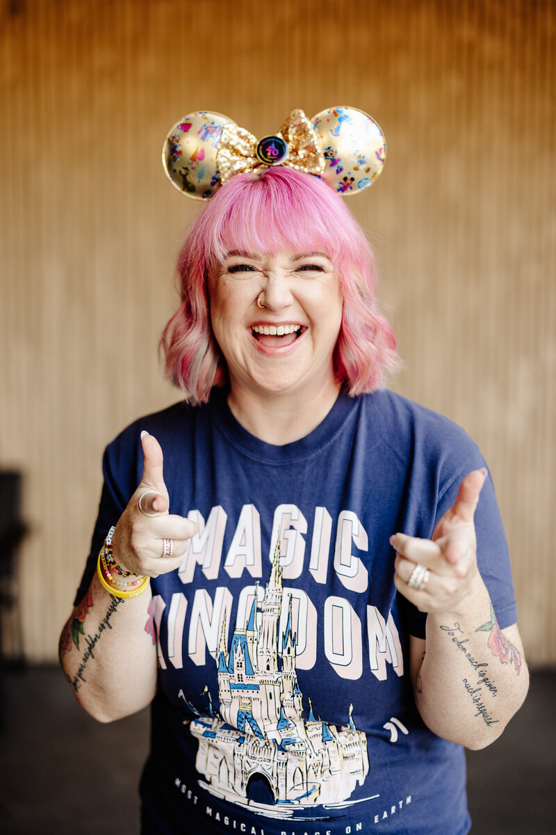 Ashley Ebert smiles while teaching a session to grow your wedding business