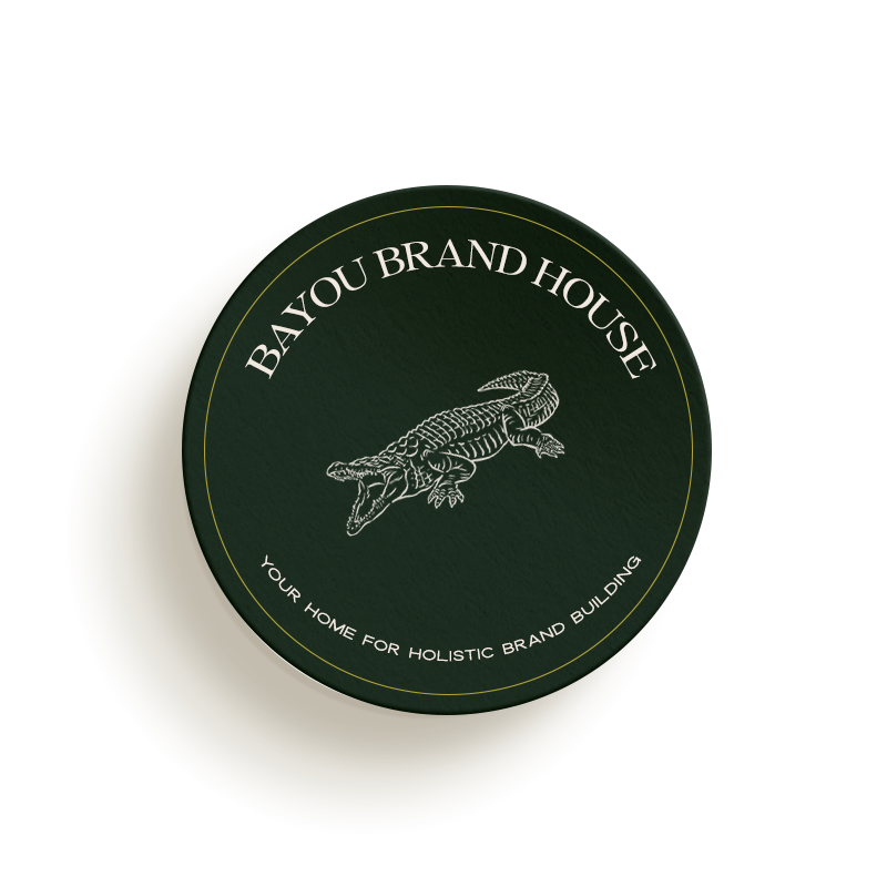 Round dark green emblem with the text "Bayou Brand House" and "Your Home for Holistic Brand Building," featuring a detailed sketch of an alligator in the center, showcasing the expertise of a custom Showit designer.