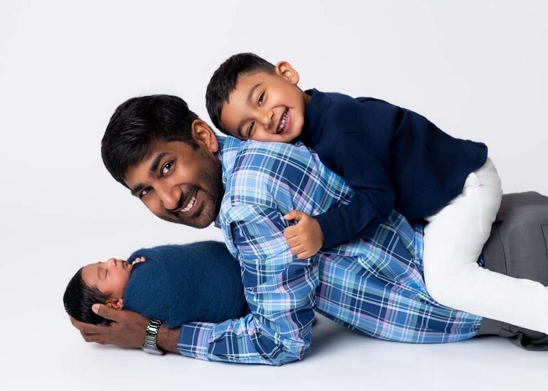 older-sibling-looking-at-newborn-baby-portrait-14