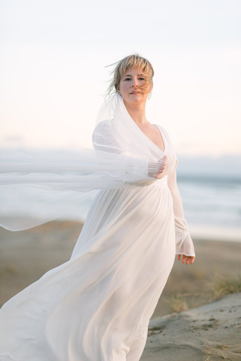 A bride on a beach in Tofino, BC