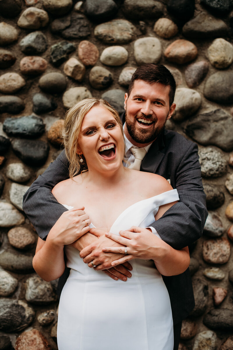 Bride and groom laughing