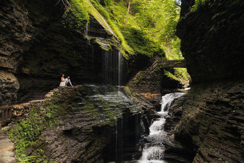bride and groom eloping in watkins glen new york overlooking waterfalls