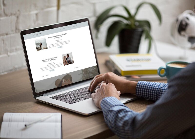 person on a laptop with the lily anderson showit website template on the screen