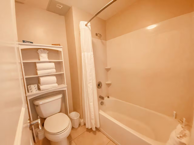 bathroom with tub and shower