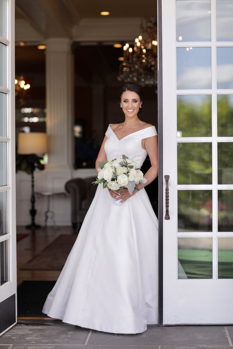 Bride posing in door