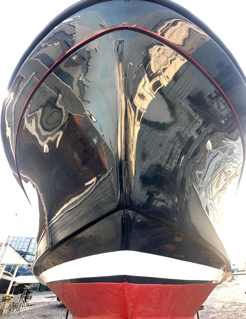 Front view of a black and red yacht