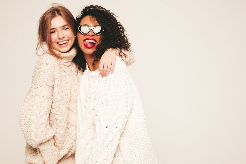 two-young-beautiful-smiling-hipster-girls-trendy-winter-sweaters-positive-models-having-fun-hugging