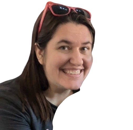 Close-up of the travel advisor's face, red sunglasses perched on her head and an inviting smile on her face.