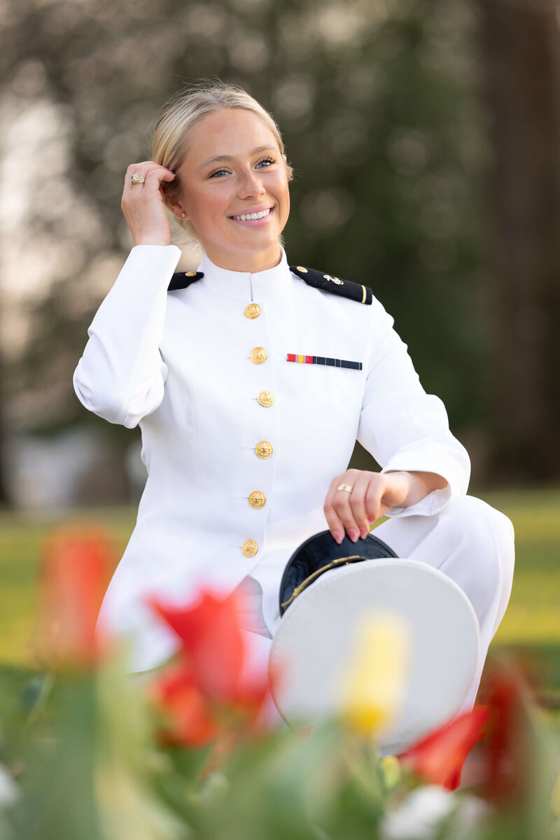 USNA Midshipman in white uniform on the steps of Bancroft Hall for photo by Kelly Eskelsen.