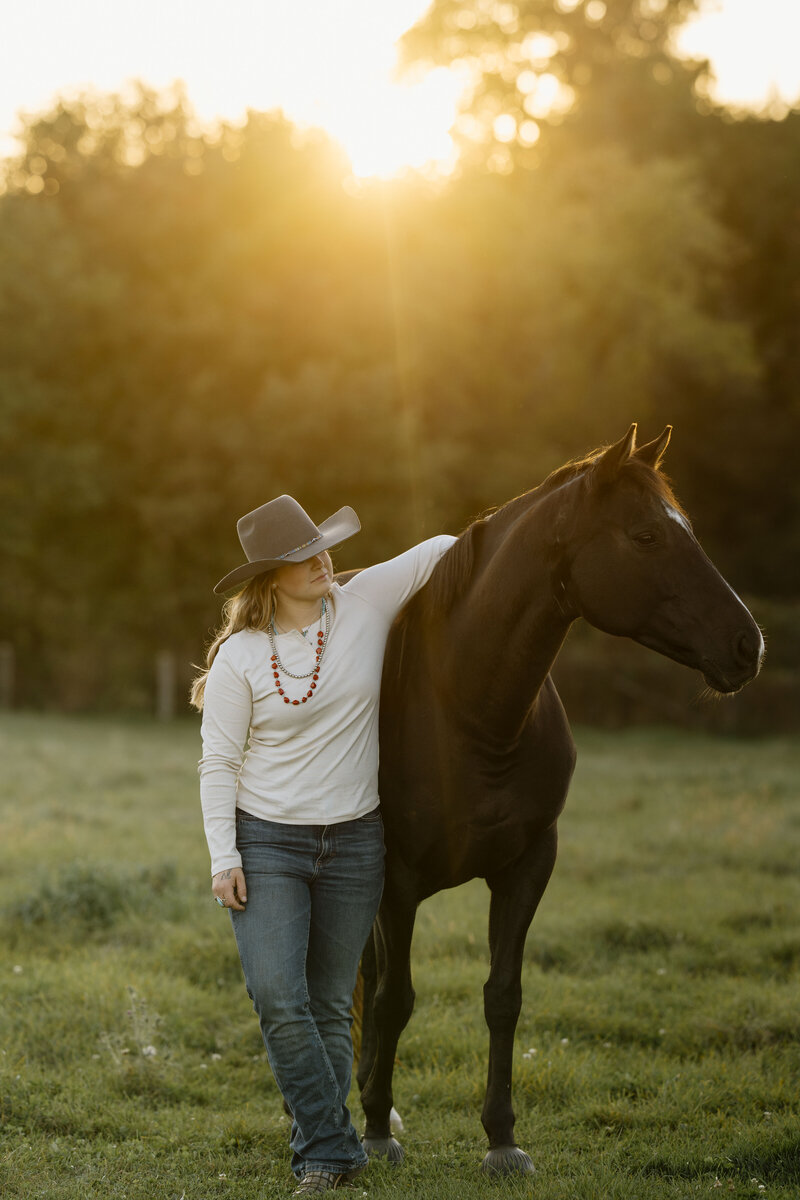 a girl and her black horse at sunset in Ontario captured by an equine photographer