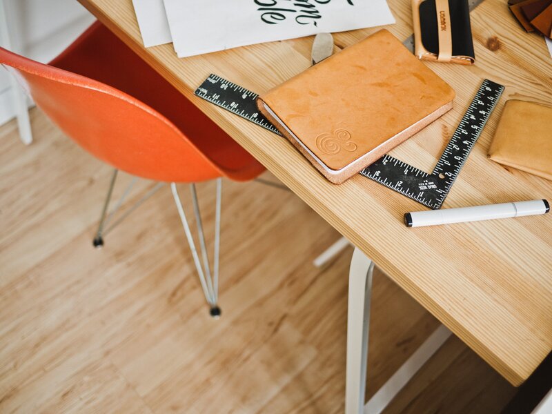 Desk with sketchbook and graphic design tools