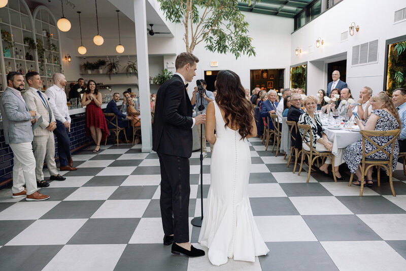 Bride and groom at Bixi Beer in Chicago, captured by Chicago wedding photographer Abe Fernandez in a candid, documentary style using digital and 35mm film