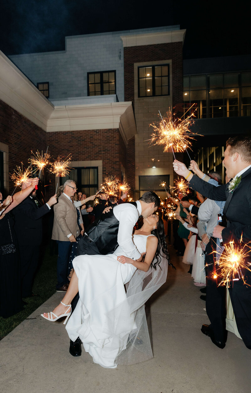 Candid sparkler send-off captured by Ohio wedding photographer for joyful, modern couples celebrating in style.