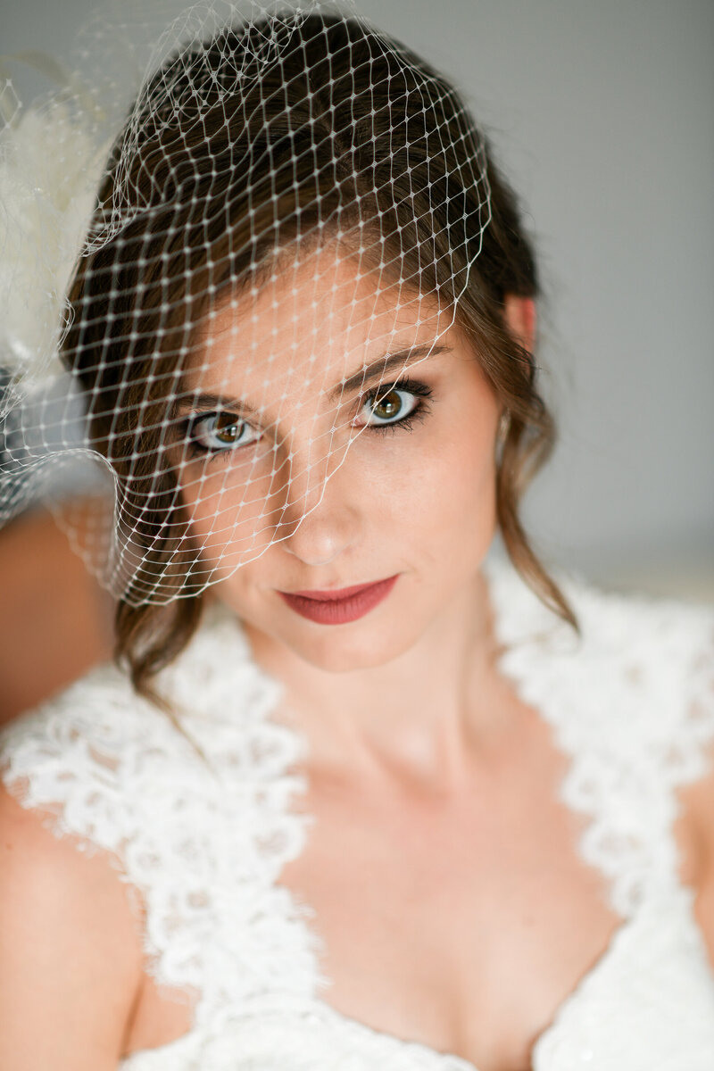 A portrait of a bride with her veil in Stratford, Ontario