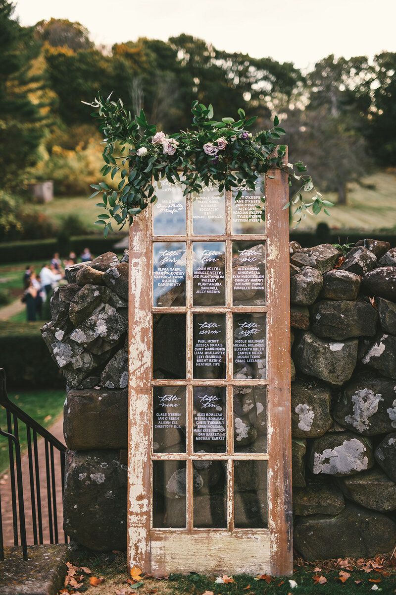 Rustic wood door seating chart rental