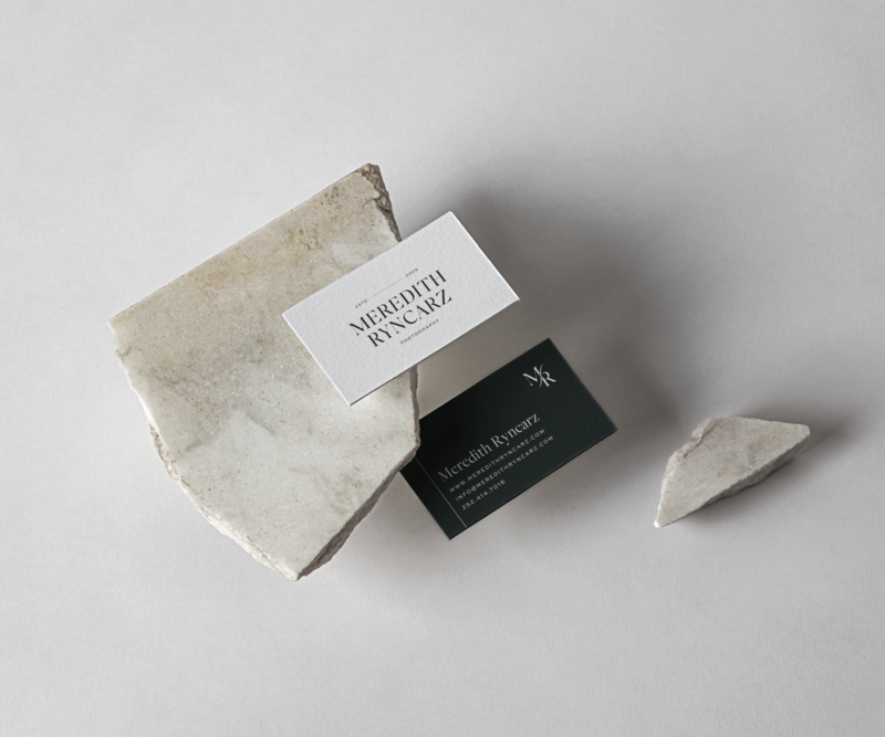 Business card on top of stone.