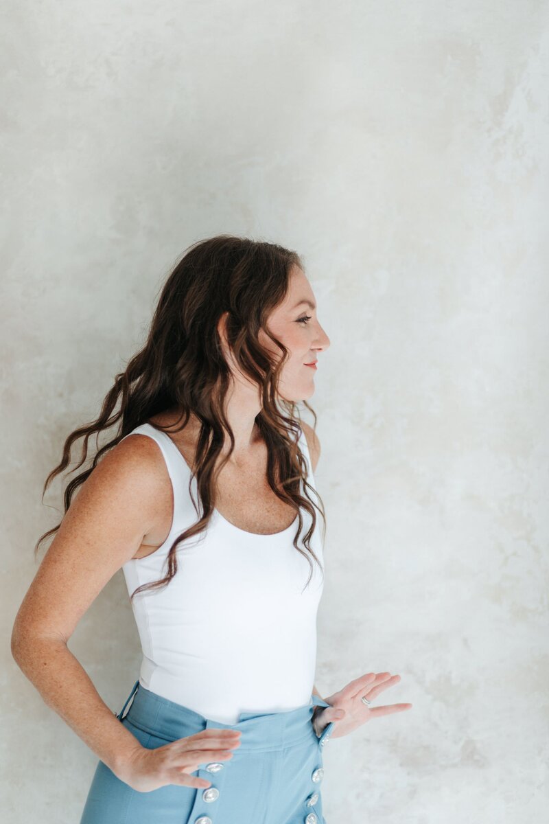 Elizabeth twirling in white shirt