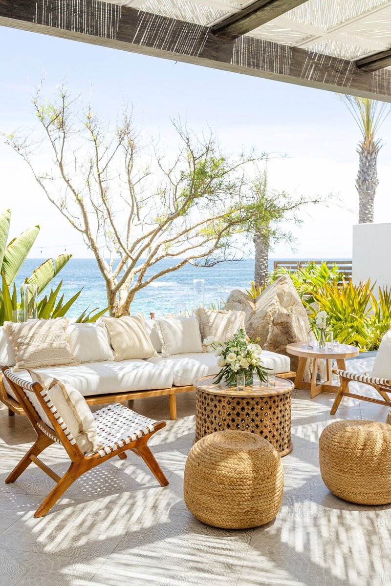 An elegant beachside leisure scene with natural patio furniture