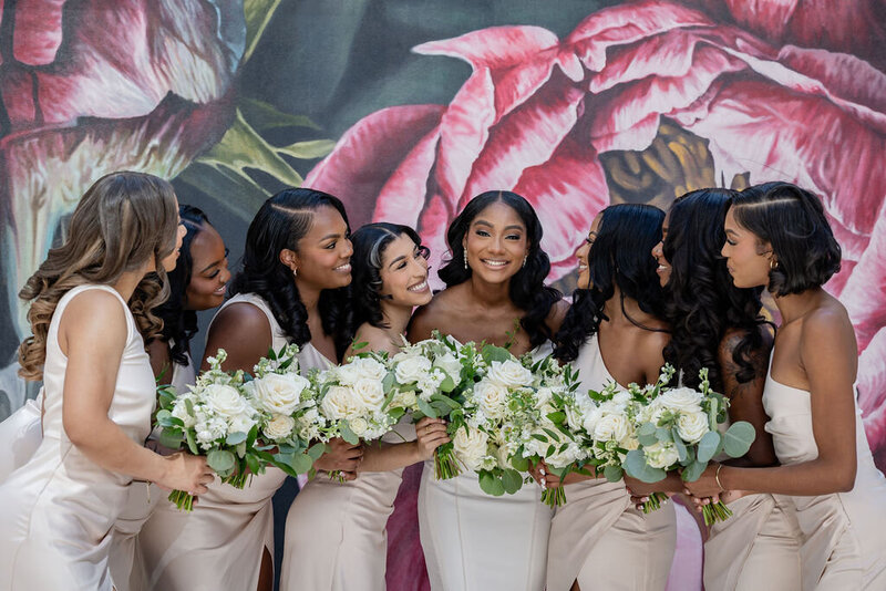 a bride with her bridesmaids at her uptown charlotte wedding