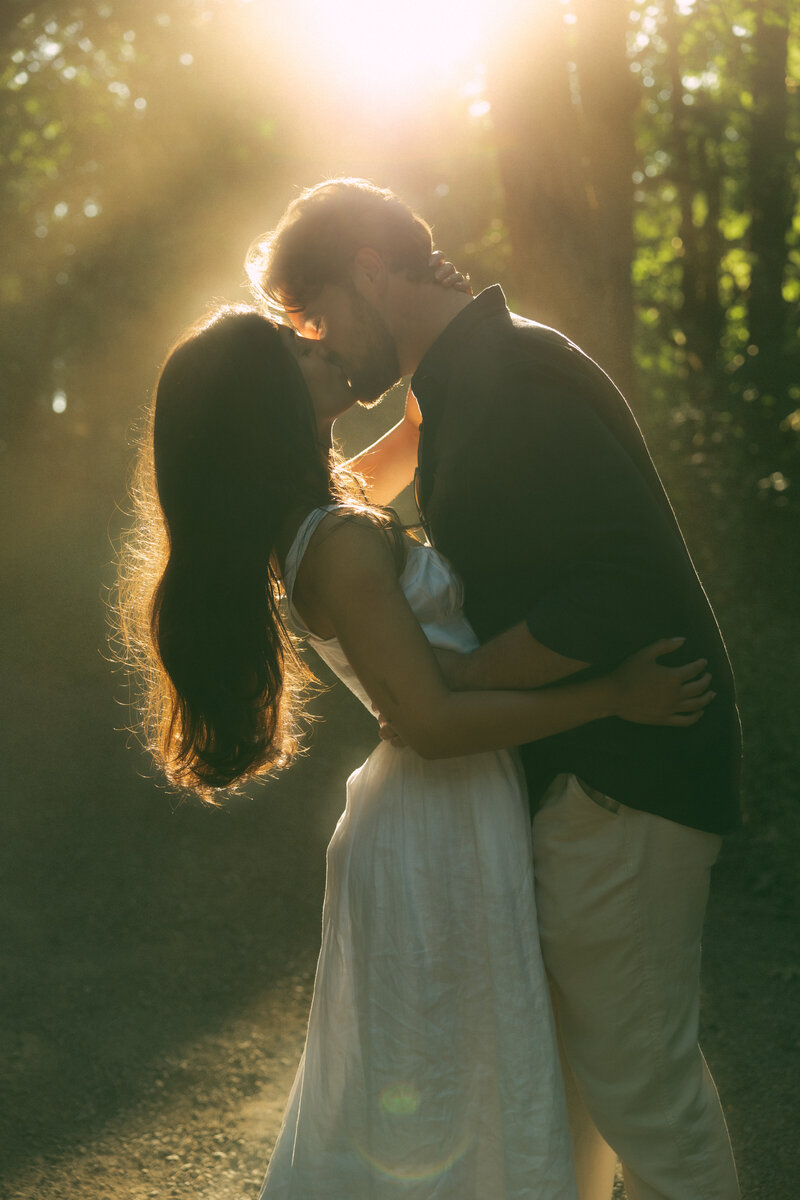 Coastal elopement couple in grassy field on Vancouver Island, captured in warm, artful storytelling style