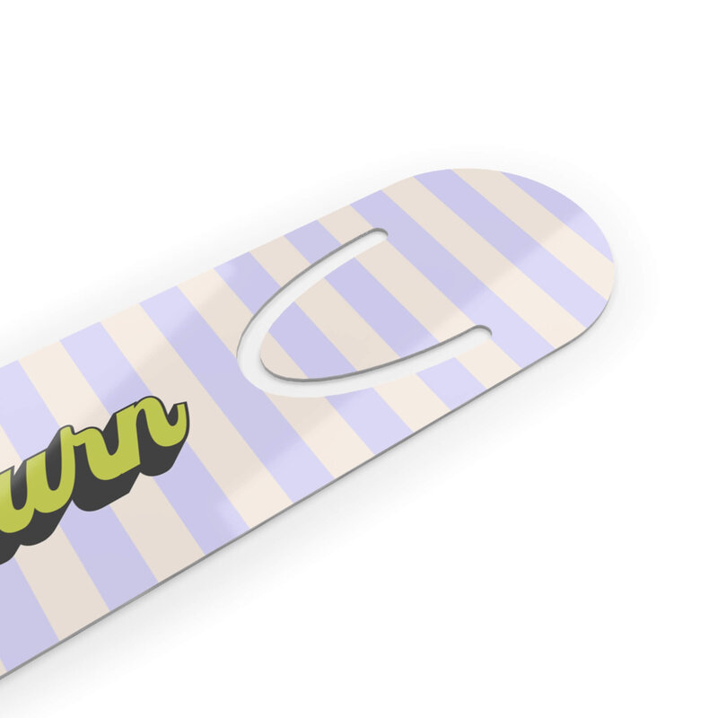 A cream and purple striped bookmark that says slow burn.

