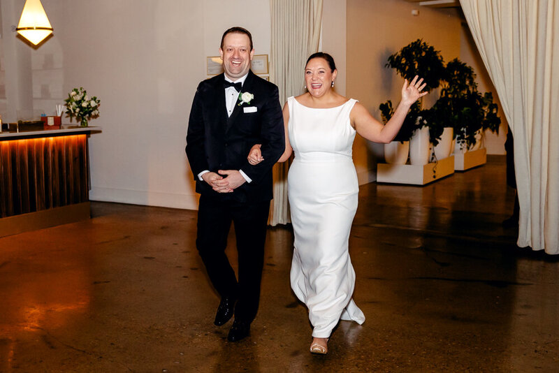 Bride and groom entering their reception at Saint Elle wedding venue in Nashville, TN