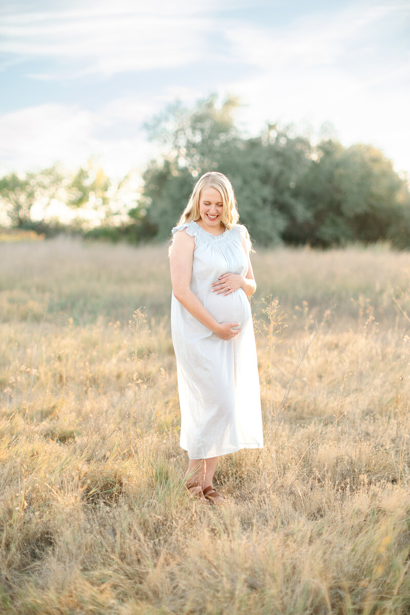 In-studio Maternity Session with floor floral arrangments for mother's day minis photoshoot