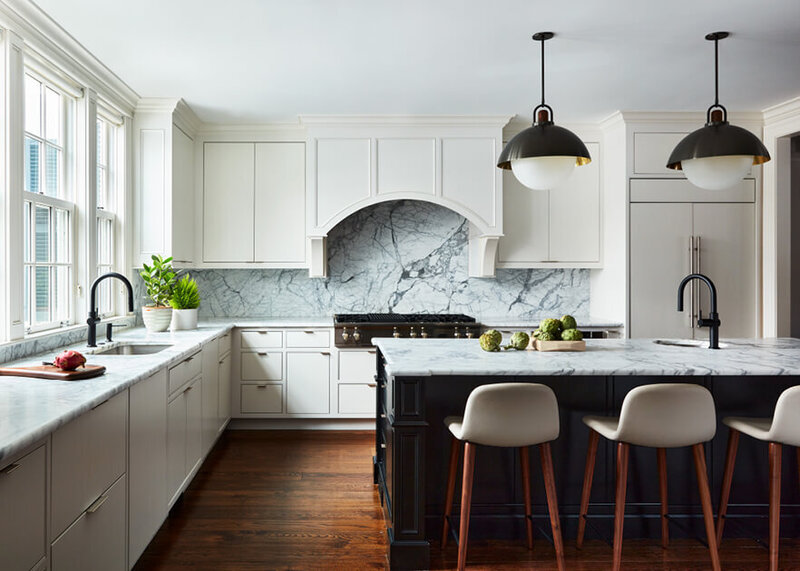 Concord interior designer creates a new kitchen in a historic home with white cabinets, a black island, modern stools, and luxury light fixtures from Allied Maker.