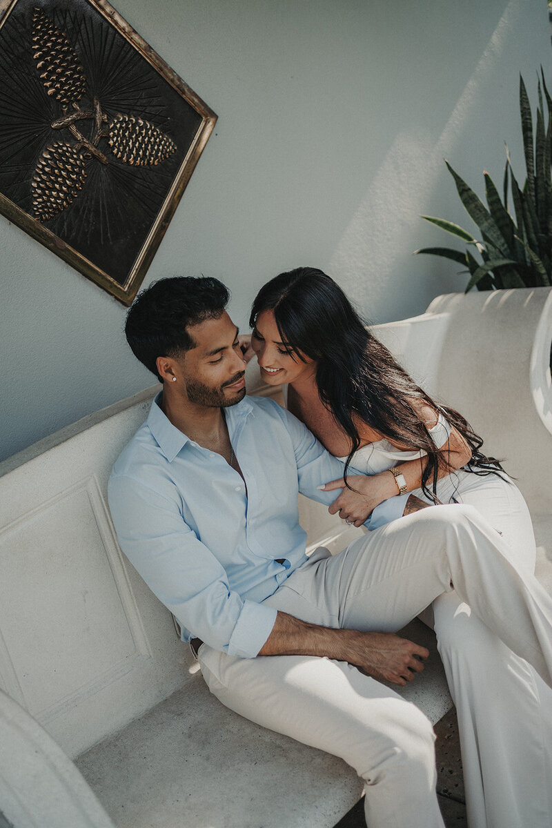 smiling couple cuddling engagement session
