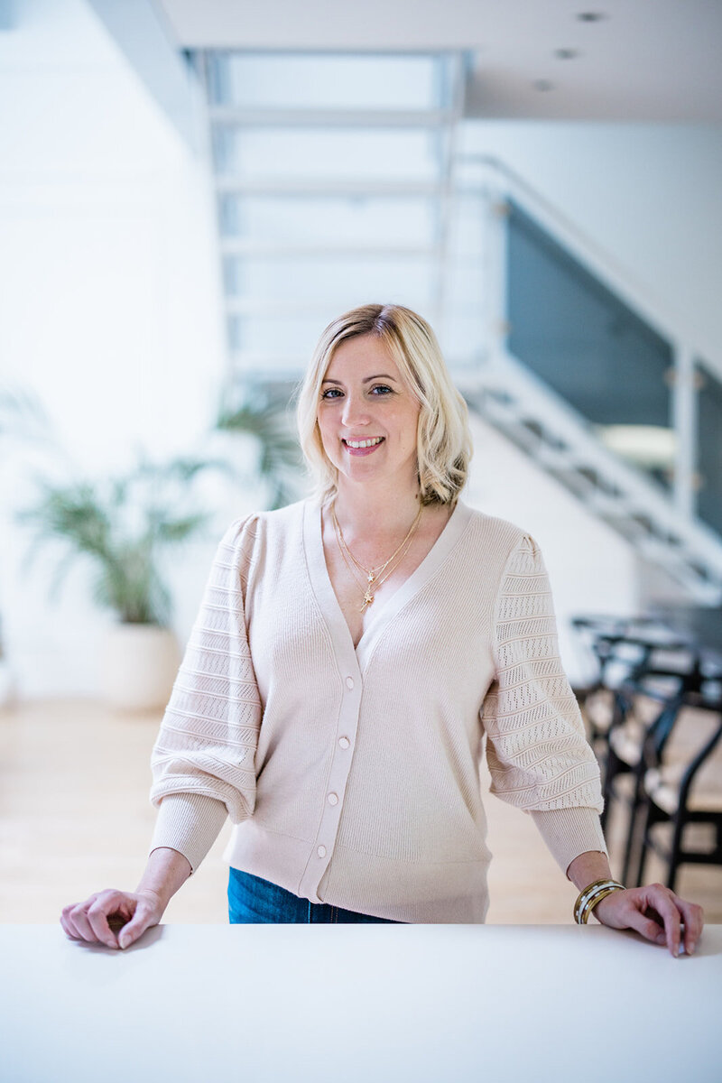 Nova Cobban, Psychologist specialising in generational divide at work, leaning on counter