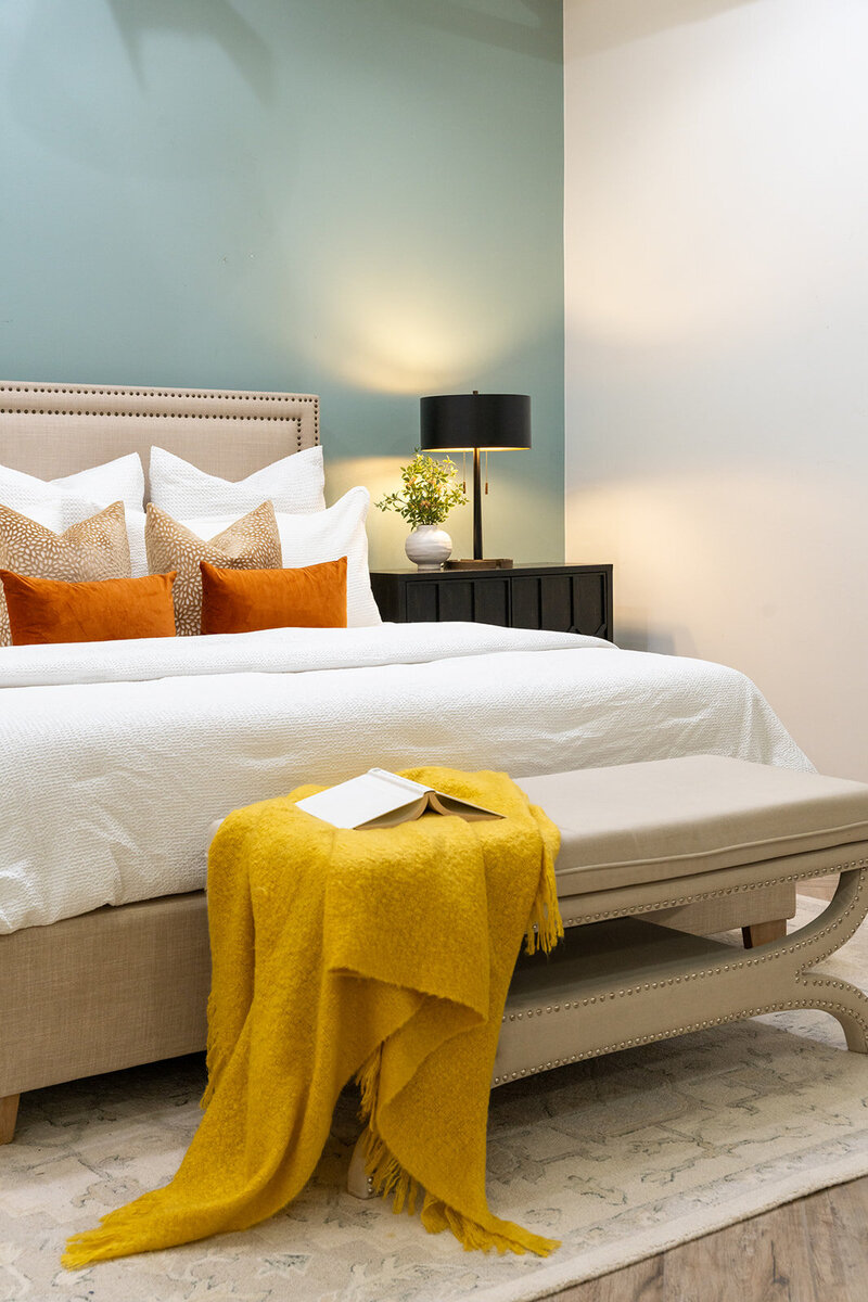 white bed with orange and yellow accents