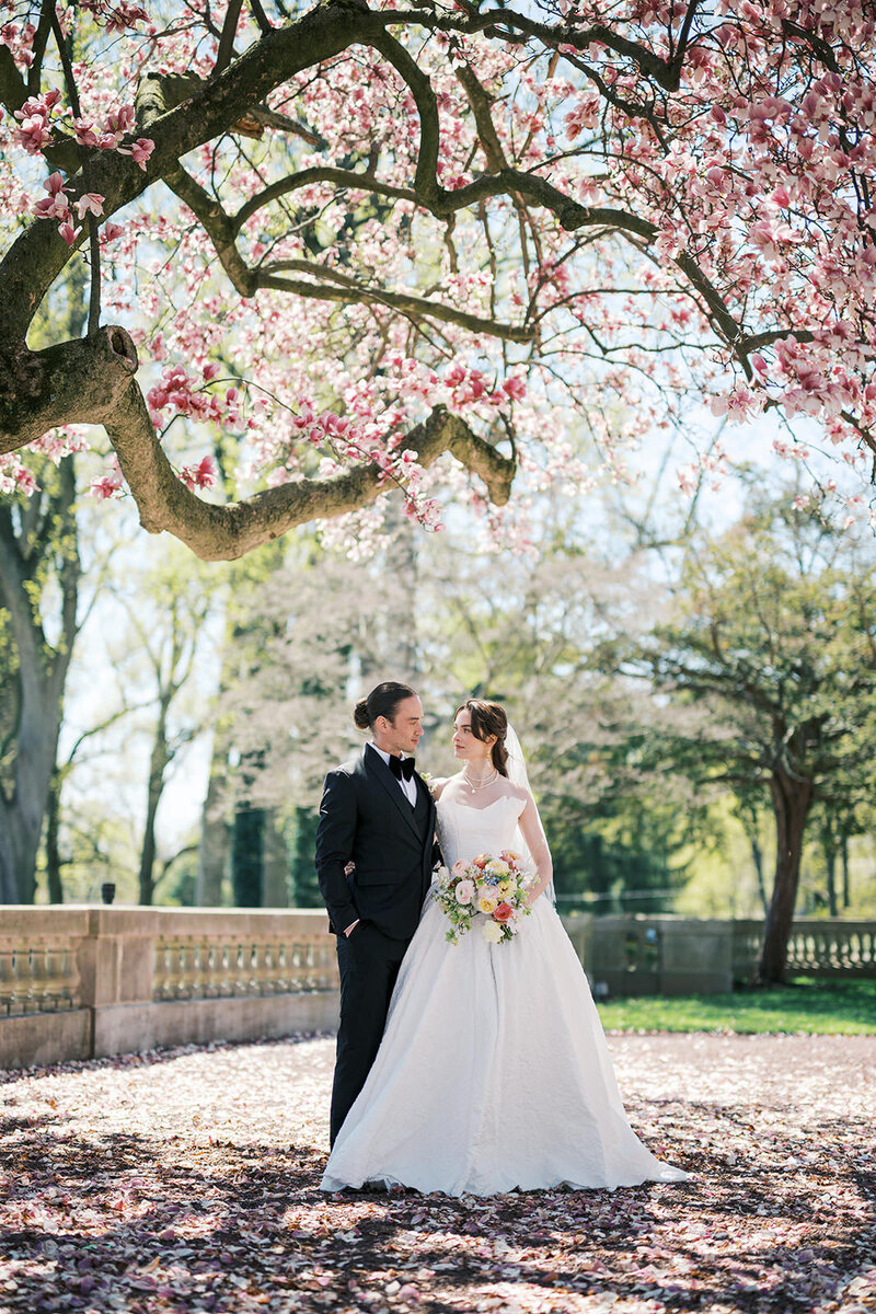 Bride and groom kissing on the stairs at Park Chateau wedding in NJ