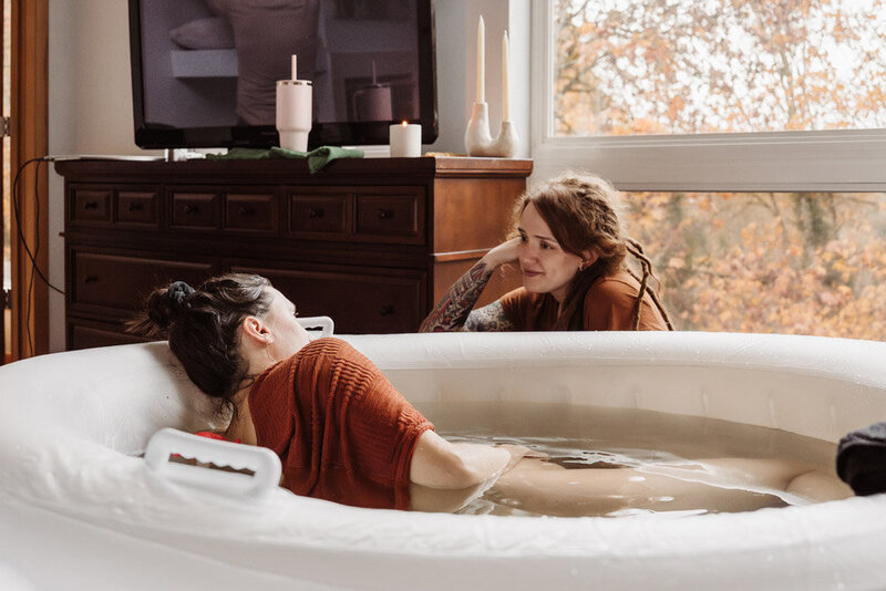 Natalie Broders birth doula with a client in the birth tub at a home birth