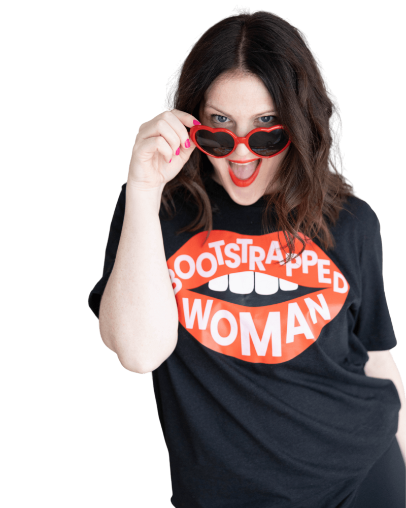 Emily confidently wearing red sunglasses and a black shirt with "bootstrapped woman" printed on it, showcasing her bold personality.