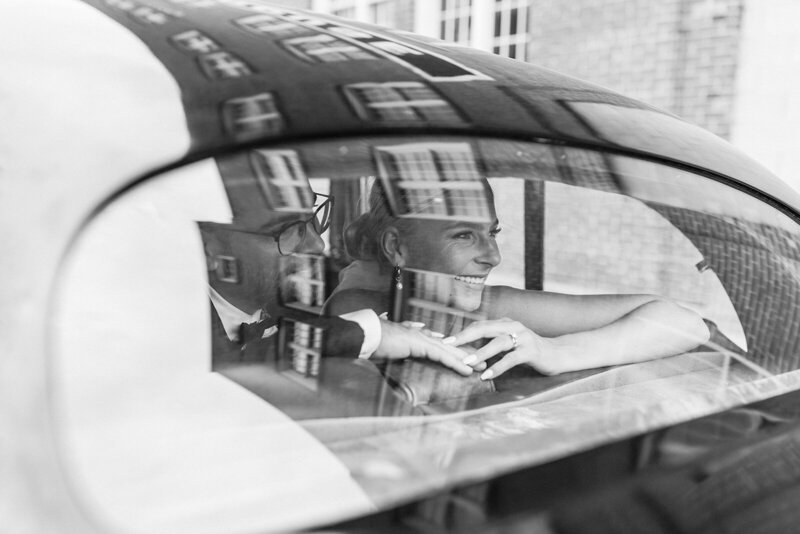 man and women dancing in field laughing