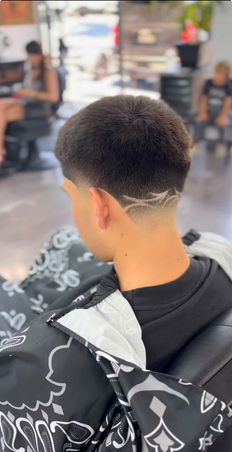 A finished haircut with a design at the nape at Onyx Barbershop in Wildomar, CA.