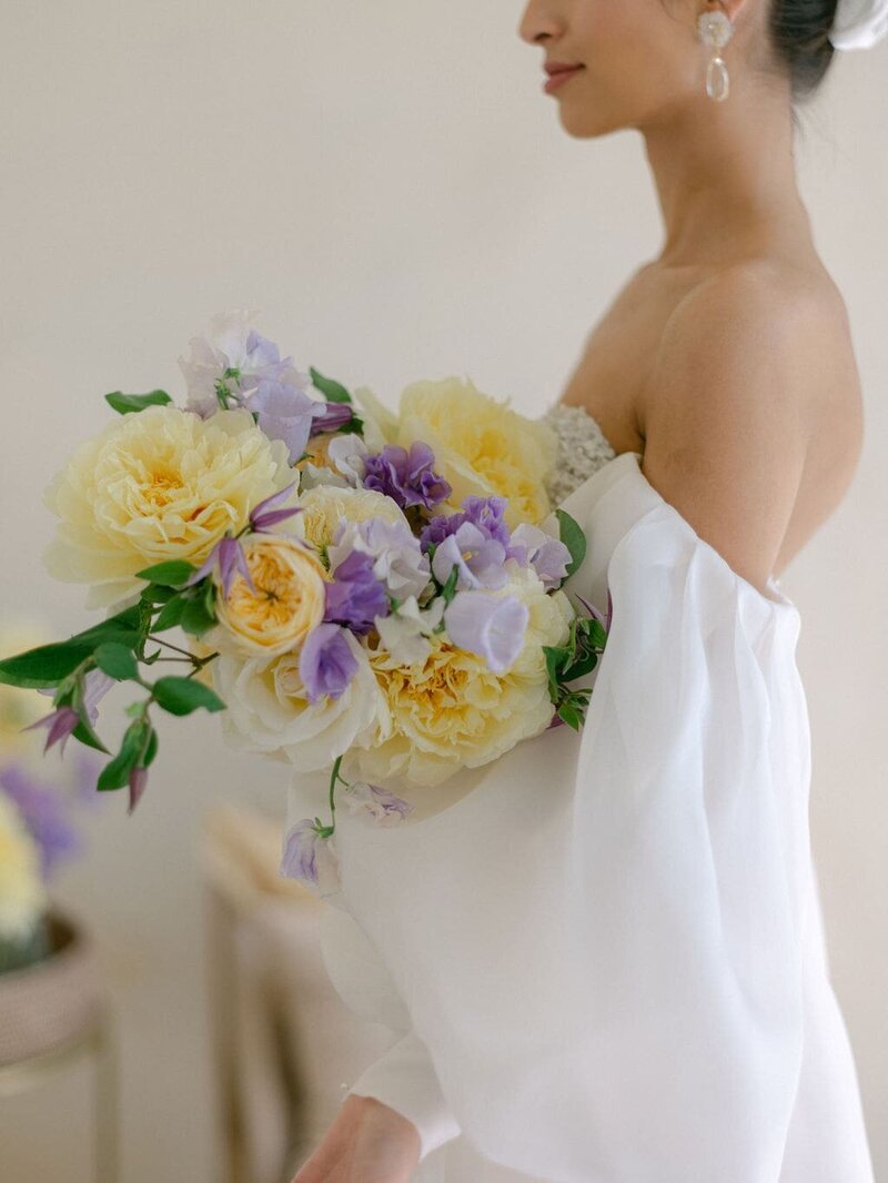 Bride with a lilac and yellow bridal bouquet