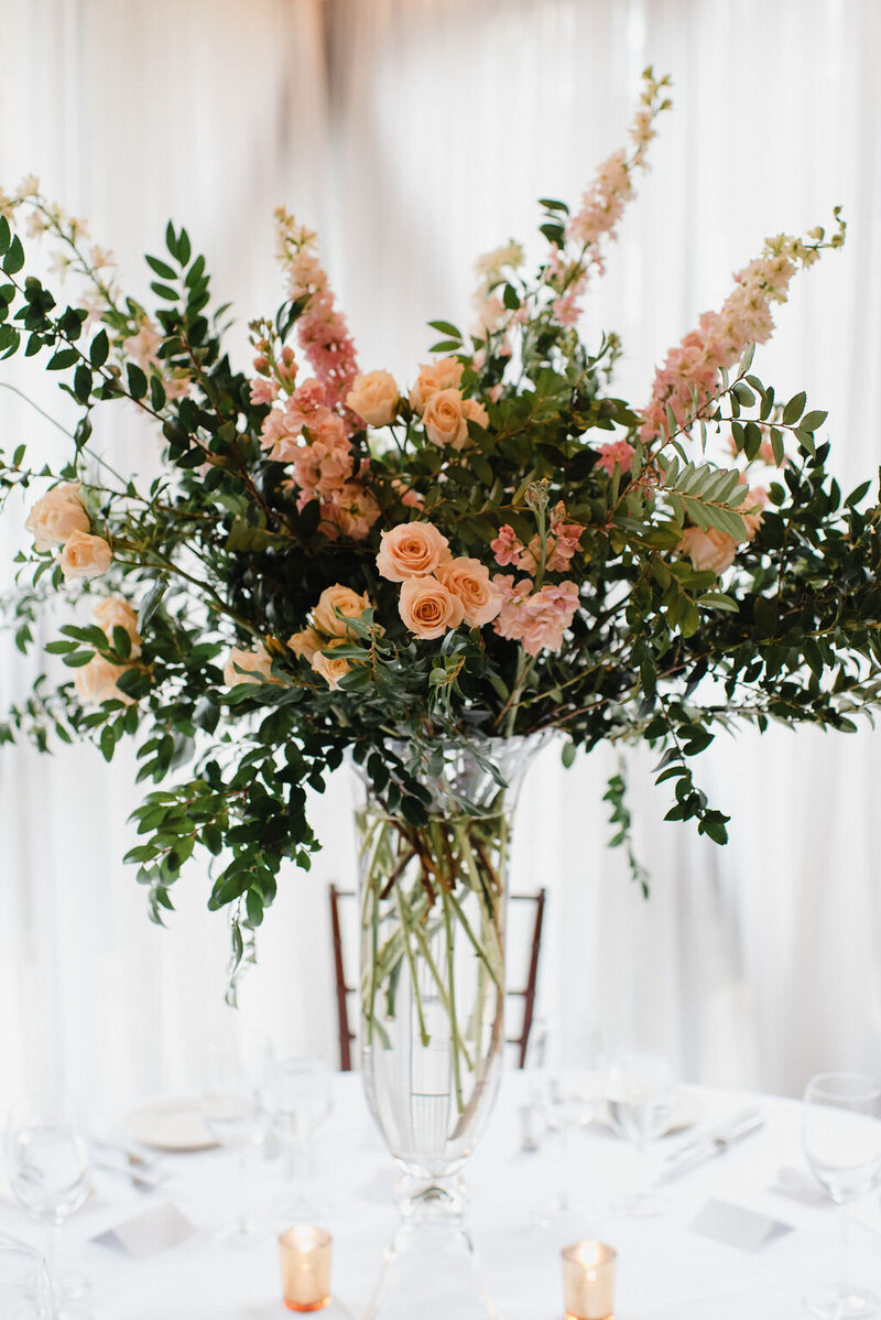 Photo of a boquet of flowers on a desk.