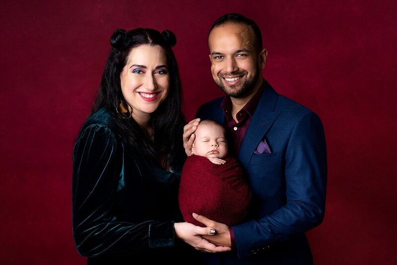 Rich jewel tones newborn family portrait